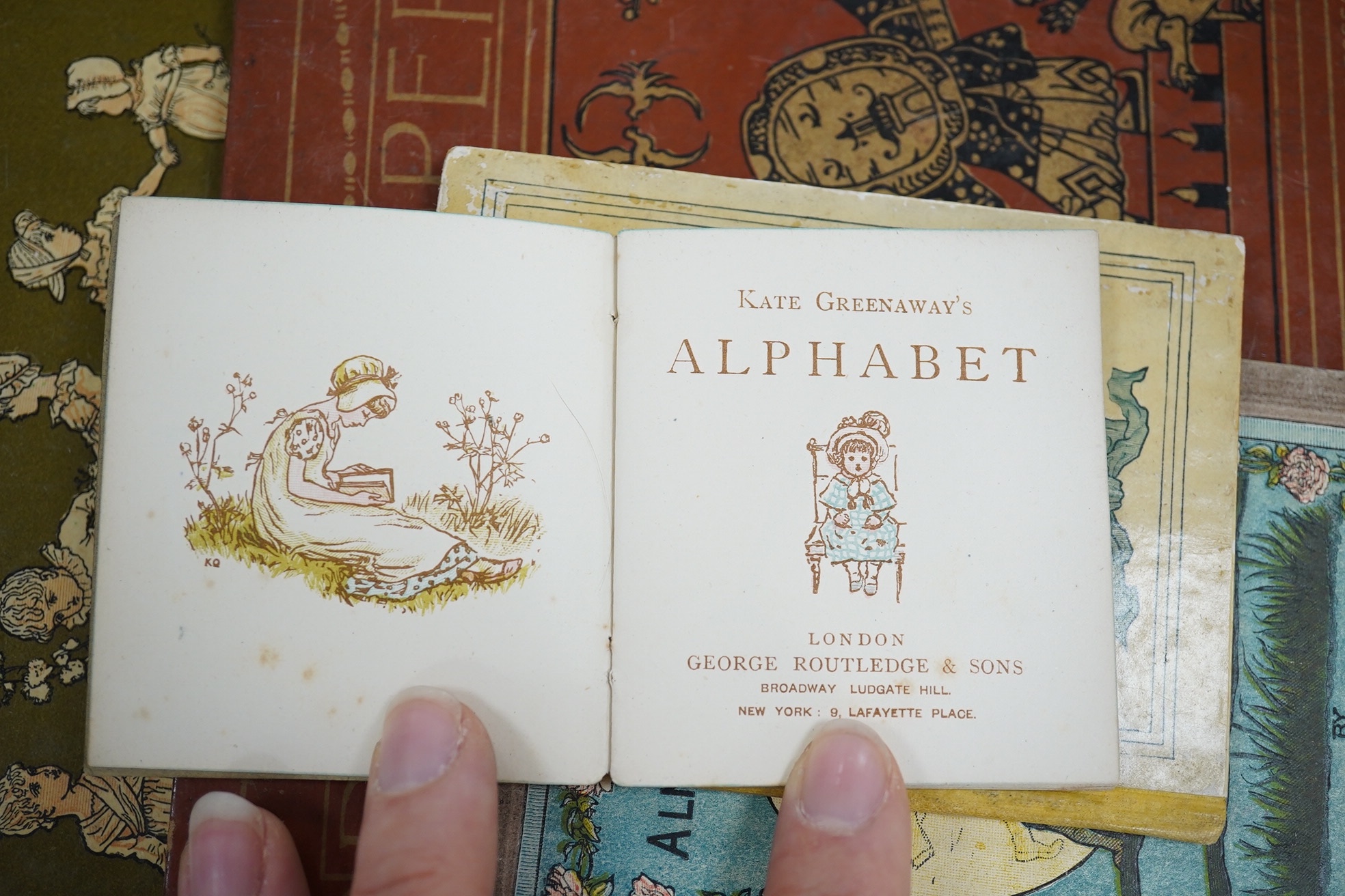 Greenaway, Kate - Kate Greenaway's Alphabet. coloured illus. throughout; original coloured pictorial boards, very sm. 8vo. (1885); Greenaway, Kate - Almanack for 1883. coloured illus.; original coloured pictorial boards,